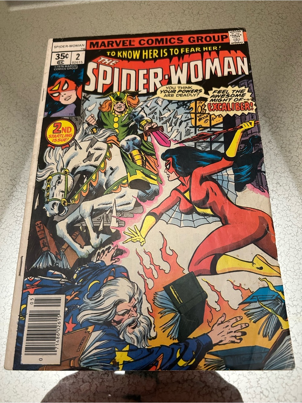 Marvel Spider-Woman Comic Cover โ Red, Yellow & Green Artwork